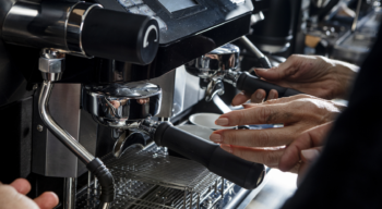 close up of hands making coffee