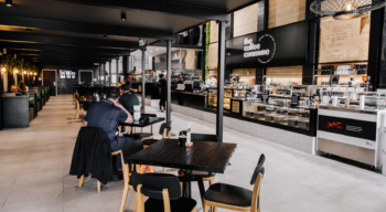 the coffee commune image with text 'what the new vaccination rules means for cafe owners in queensland'
